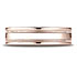 This 6mm comfort-fit carved design band features a high polished finish with milgrain and a round edge.